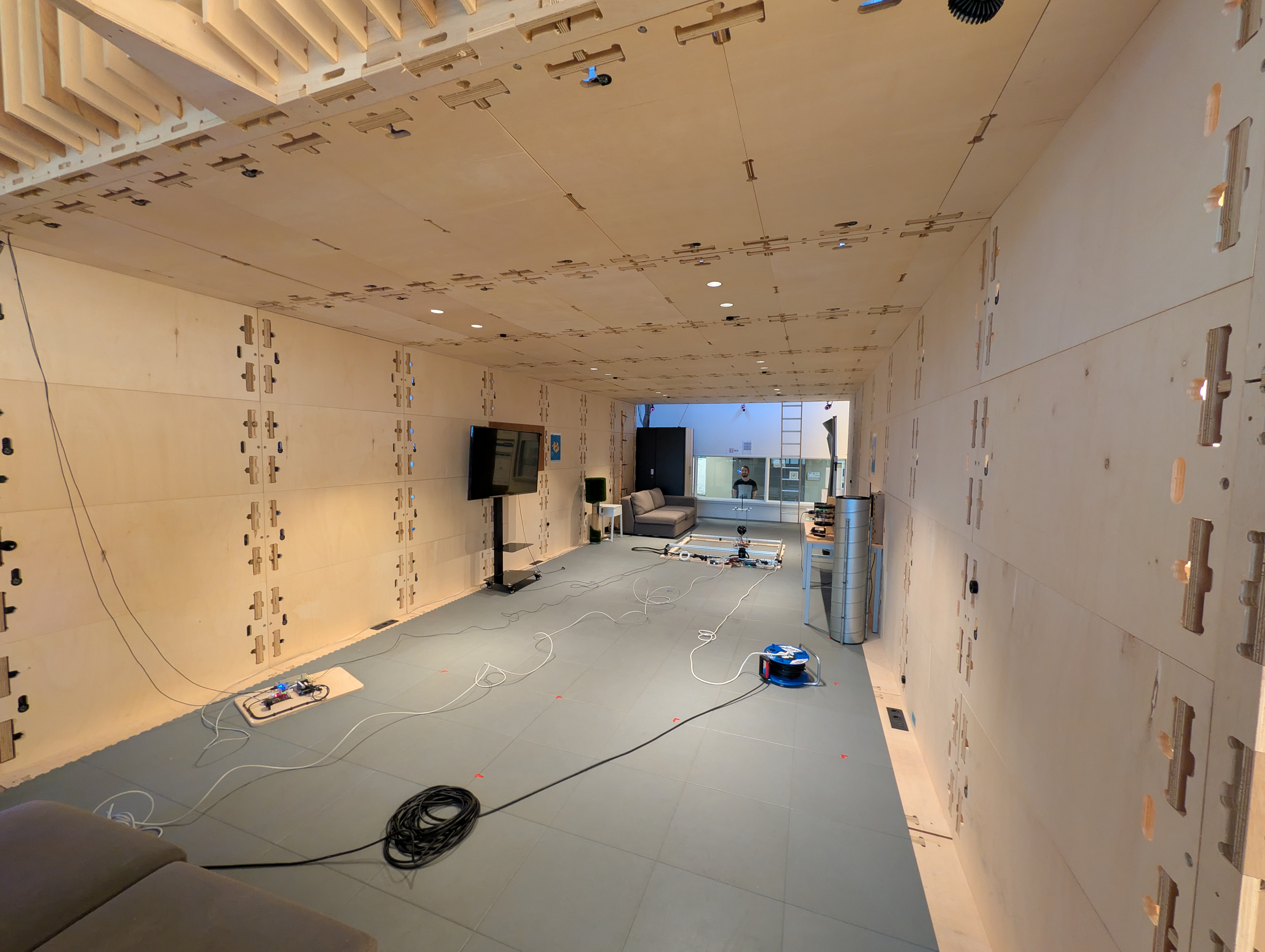 Wide view of the Techtile measurement room used for the ELLIIIT dataset experiments.