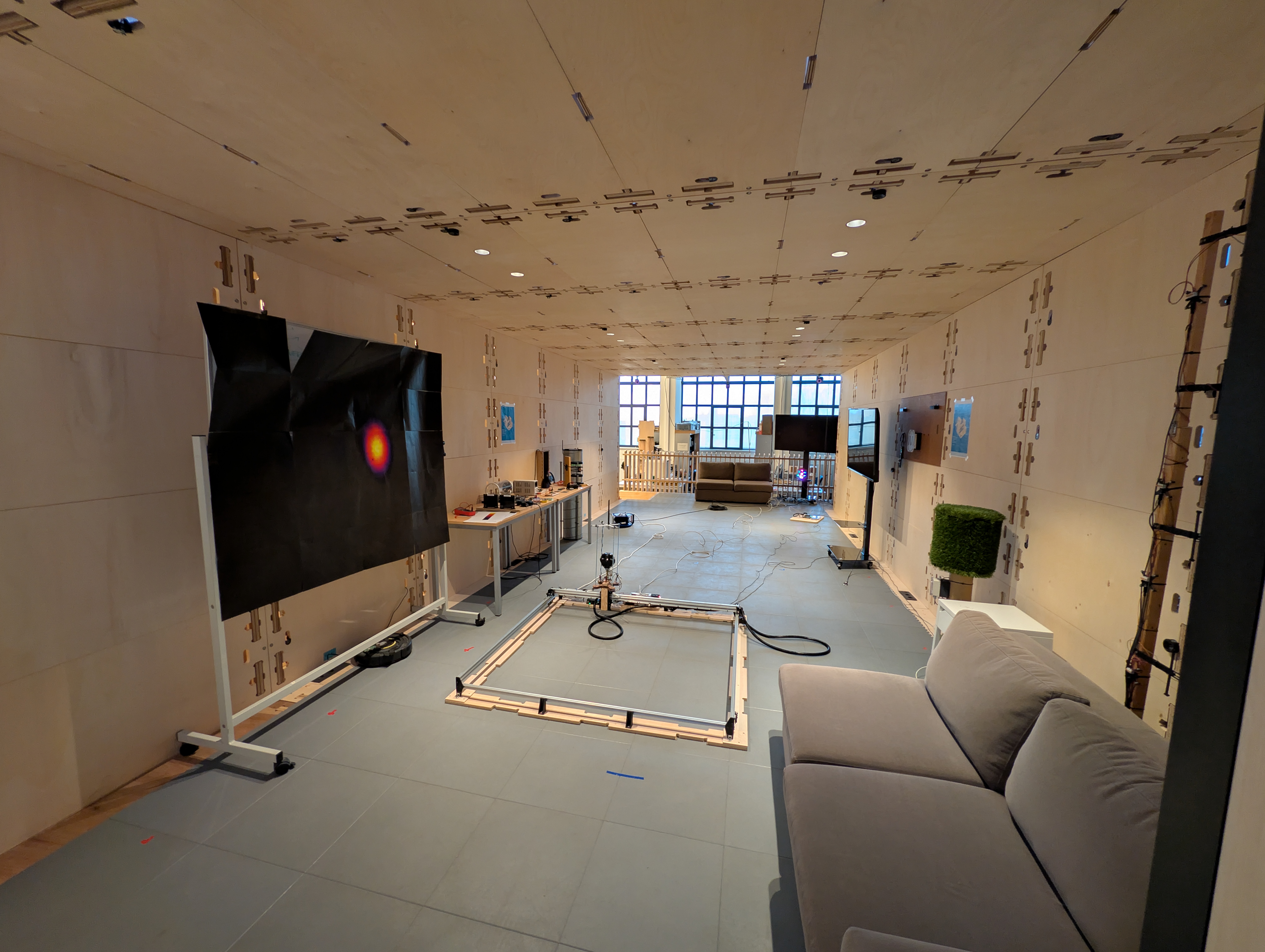 Techtile measurement setup with the rover frame and display wall used during ELLIIIT dataset acquisition.
